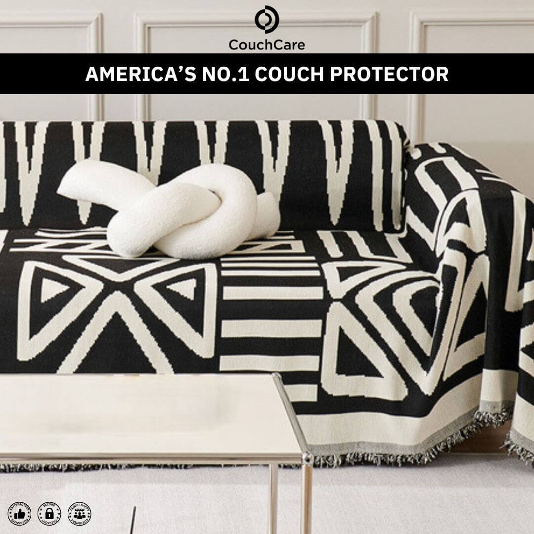 CouchCare Pro Protector in a black patterned design on a couch