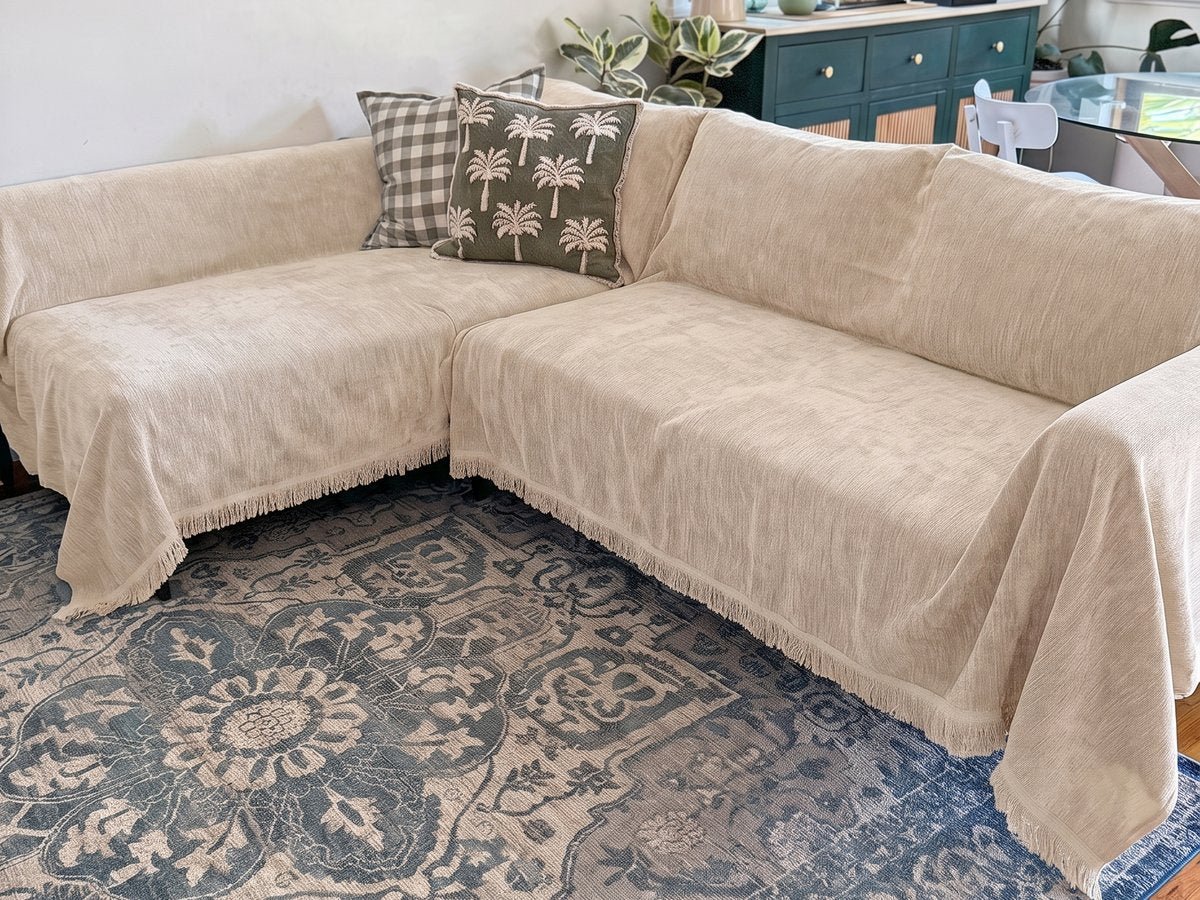 Corner sectional covered with cream CouchCare protectors